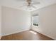 Bright, empty bedroom features hardwood floors, a ceiling fan, and a large window at 1315 Palm Cove Dr, Charleston, SC 29492