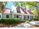 Exterior view of the community clubhouse with manicured landscaping and a red metal roof at 1315 Palm Cove Dr, Charleston, SC 29492