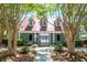 Exterior view of the community clubhouse framed by trees and lush landscaping at 1315 Palm Cove Dr, Charleston, SC 29492
