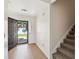 Inviting entryway features wood flooring, stairs, and an open door to the home's exterior at 1315 Palm Cove Dr, Charleston, SC 29492