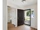 Bright entryway with hardwood floors, white trim and view into the living area at 1315 Palm Cove Dr, Charleston, SC 29492
