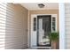 Inviting front entrance featuring a glass storm door and decorative plant at 1315 Palm Cove Dr, Charleston, SC 29492