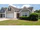 Attractive single-Gathering home featuring a manicured lawn and an attached garage at 1315 Palm Cove Dr, Charleston, SC 29492