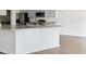 Bright kitchen island with modern faucet, cabinetry, and granite countertops at 1315 Palm Cove Dr, Charleston, SC 29492