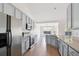 Modern kitchen featuring stainless steel appliances, granite countertops, and sleek gray cabinetry at 1315 Palm Cove Dr, Charleston, SC 29492