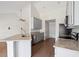 Modern kitchen with stainless steel appliances, granite countertops, and wood-look flooring at 1315 Palm Cove Dr, Charleston, SC 29492