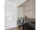 Well-lit laundry room with modern LG washer and dryer units and convenient overhead shelving at 1315 Palm Cove Dr, Charleston, SC 29492