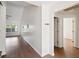 Open-concept living space with high ceilings, hardwood floors, and lots of natural light at 1315 Palm Cove Dr, Charleston, SC 29492