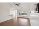 Spacious living area featuring wood floors, a ceiling fan, and a view of the kitchen at 1315 Palm Cove Dr, Charleston, SC 29492