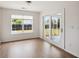 Bright living room with hardwood floors and sliding glass doors leading to the patio at 1315 Palm Cove Dr, Charleston, SC 29492