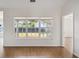 Bright living room with hardwood floors, a large window, and neutral wall color at 1315 Palm Cove Dr, Charleston, SC 29492