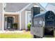 Close-up of the mailbox with address 1315 in front of the property with well-kept lawn at 1315 Palm Cove Dr, Charleston, SC 29492