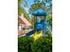 Community playground featuring colorful slides and climbing structures surrounded by lush landscaping at 1315 Palm Cove Dr, Charleston, SC 29492