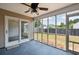 Relaxing screened-in porch offering a peaceful view of the backyard and neighborhood at 1315 Palm Cove Dr, Charleston, SC 29492