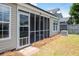 Close up of the home's screened in porch, central air conditioning and solar panels on the roof at 1315 Palm Cove Dr, Charleston, SC 29492