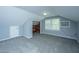 Spacious finished attic featuring carpet flooring, closet, and great natural light from window, perfect for flexible living at 136 Harrow Pl, Goose Creek, SC 29445
