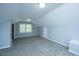 Spacious attic with natural light, neutral color palette, and gray carpeting at 136 Harrow Pl, Goose Creek, SC 29445