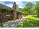 Brick home with a landscaped backyard and patio, perfect for outdoor entertaining and relaxing at 136 Harrow Pl, Goose Creek, SC 29445