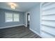 Charming bedroom with a window, stylish lighting, and a built-in white bookshelf at 136 Harrow Pl, Goose Creek, SC 29445