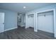 Bright bedroom featuring gray flooring, two closets and ensuite bathroom entrance at 136 Harrow Pl, Goose Creek, SC 29445