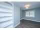 Bright bedroom featuring wood floors, neutral paint and large, built-in shelving at 136 Harrow Pl, Goose Creek, SC 29445