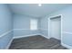 Bright bedroom featuring gray flooring, a window, and closet at 136 Harrow Pl, Goose Creek, SC 29445
