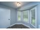 Breakfast nook with a bay window, gray flooring and white trim at 136 Harrow Pl, Goose Creek, SC 29445