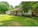 Attractive single story house showcasing manicured landscaping and a cozy covered porch at 136 Harrow Pl, Goose Creek, SC 29445
