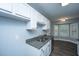 Clean kitchen with stainless steel appliances, white cabinets, and granite countertops at 136 Harrow Pl, Goose Creek, SC 29445
