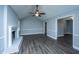 Cozy living room with vaulted ceiling, fireplace, and gray flooring at 136 Harrow Pl, Goose Creek, SC 29445