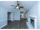 Comfortable living room with vaulted ceilings, a ceiling fan, and a painted brick fireplace at 136 Harrow Pl, Goose Creek, SC 29445