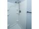 Bathroom with a shower featuring built-in shelves and an adjustable shower head, providing convenience and modern style at 136 Harrow Pl, Goose Creek, SC 29445