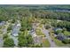 Aerial view of a residential area showcasing manicured lawns, mature trees, and a serene neighborhood setting at 1503 Pondside Ct, Summerville, SC 29485