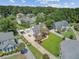 Beautiful home boasts a manicured lawn, mature trees, and a backyard swimming pool perfect for relaxing and entertaining at 1503 Pondside Ct, Summerville, SC 29485