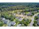 Aerial image showcases a neighborhood with lush greenery, mature trees, and well-maintained lawns at 1503 Pondside Ct, Summerville, SC 29485