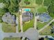 Aerial view of a home featuring a large in-ground pool and well-manicured landscaping at 1503 Pondside Ct, Summerville, SC 29485