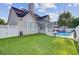 Backyard with fenced in pool, patio, and lush green grass, creating a private outdoor oasis at 1503 Pondside Ct, Summerville, SC 29485