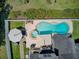 Backyard features a kidney-shaped pool with an attached spa and a covered lounge area for relaxing by the water at 1503 Pondside Ct, Summerville, SC 29485