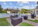 Backyard patio featuring elegant outdoor dining set, grill, and pool with a waterfall feature at 1503 Pondside Ct, Summerville, SC 29485