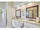 Bright bathroom with dual sinks, granite countertops, and framed mirrors with vanity lighting at 1503 Pondside Ct, Summerville, SC 29485