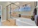 Bathroom featuring a glass-enclosed shower, soaking tub, and granite countertop at 1503 Pondside Ct, Summerville, SC 29485