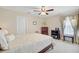Bedroom with a ceiling fan, white door, and dark wood furnishings plus a bed with patterned comforter at 1503 Pondside Ct, Summerville, SC 29485