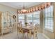 Bright breakfast nook with a modern chandelier, floral curtains, and lots of light at 1503 Pondside Ct, Summerville, SC 29485