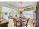 Dining room with hardwood floors, chandelier, and elegant furnishings, adjacent to the entry foyer at 1503 Pondside Ct, Summerville, SC 29485