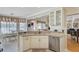 Bright kitchen features granite countertops, stainless appliances, and an island that leads to the breakfast nook at 1503 Pondside Ct, Summerville, SC 29485