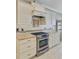 Modern kitchen features stainless steel appliances, granite countertops, custom cabinets, and decorative tile backsplash at 1503 Pondside Ct, Summerville, SC 29485
