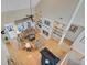 Open-concept living room with fireplace, custom bookshelves, and hardwood flooring at 1503 Pondside Ct, Summerville, SC 29485