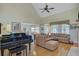 Spacious living room with vaulted ceilings, hardwood floors, a grand piano, and elegant furnishings at 1503 Pondside Ct, Summerville, SC 29485