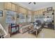 Cozy living room featuring large windows, neutral decor, and a ceiling fan at 1503 Pondside Ct, Summerville, SC 29485