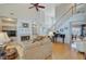 Bright living room features a fireplace with built-ins, hardwood floors, and staircase to the upper level at 1503 Pondside Ct, Summerville, SC 29485
